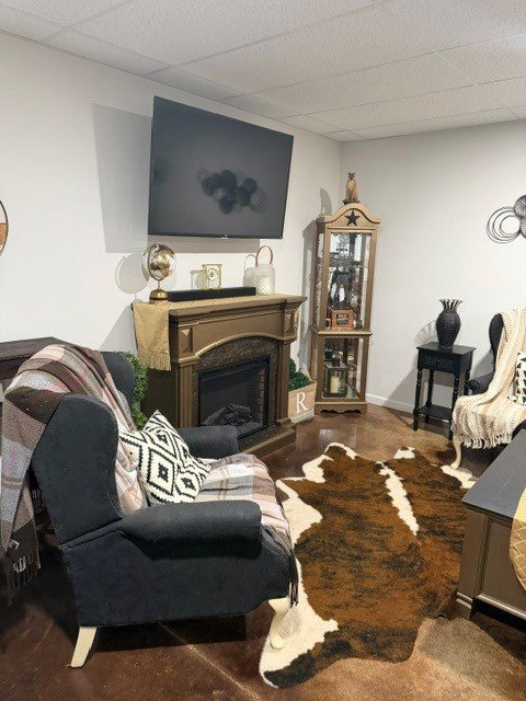 A view of the fireplace and tv area